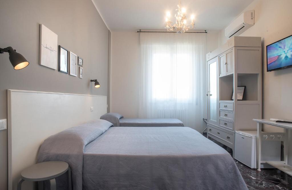 A bed or beds in a room at Hotel Careggi