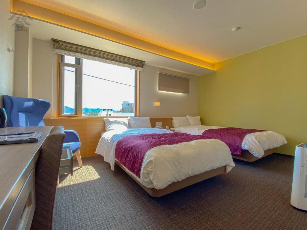 Postel nebo postele na pokoji v ubytování Hotel Noborisaka