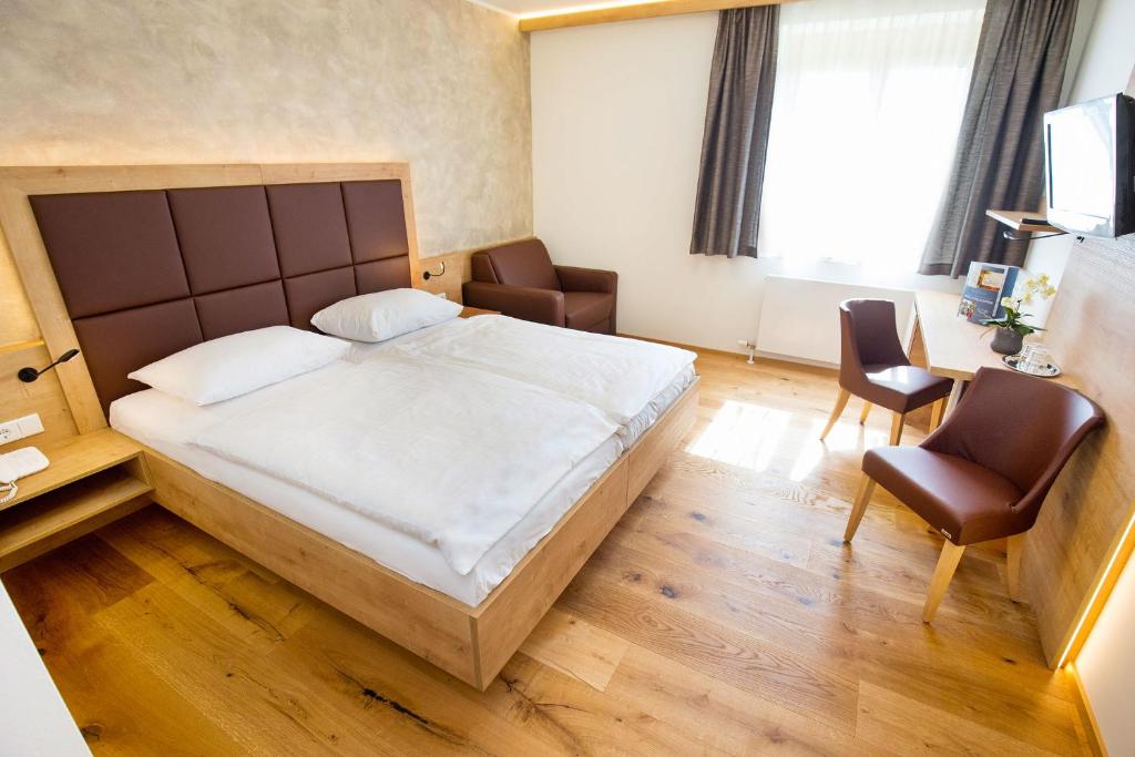 Postel nebo postele na pokoji v ubytování Hotel Stich
