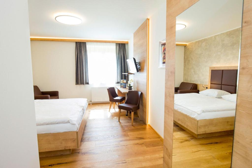 Postel nebo postele na pokoji v ubytování Hotel Stich