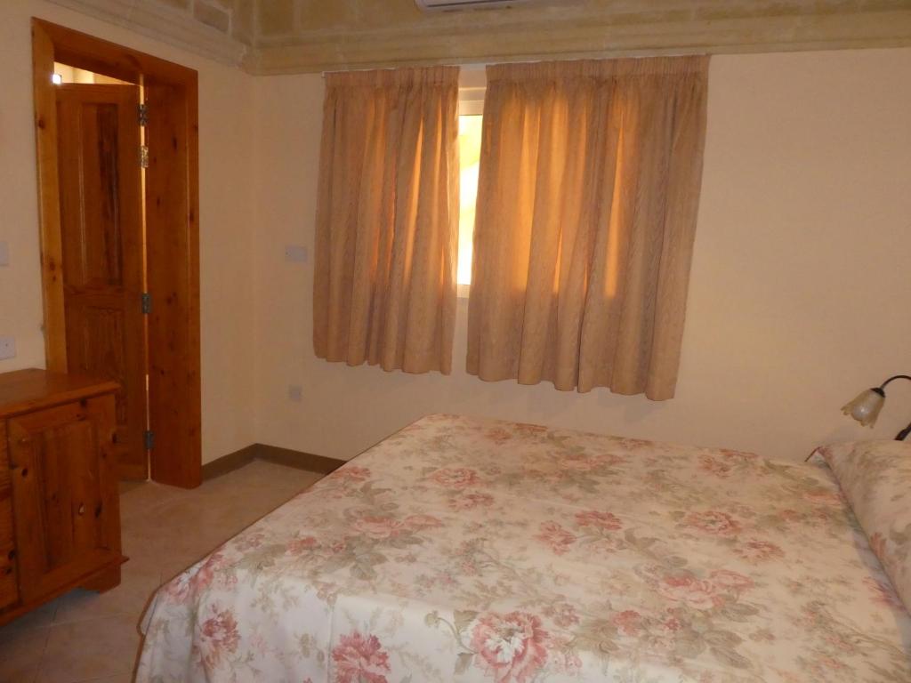 Postel nebo postele na pokoji v ubytování San Antonio Guesthouse
