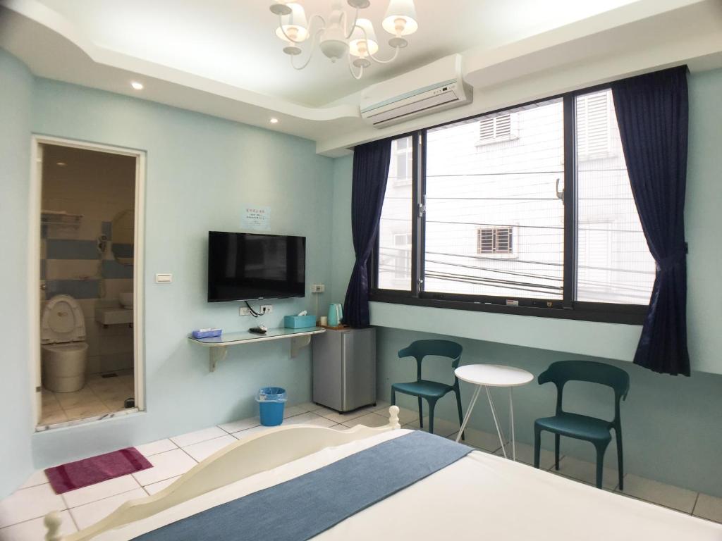 Postel nebo postele na pokoji v ubytování Hualien Dawan B&B
