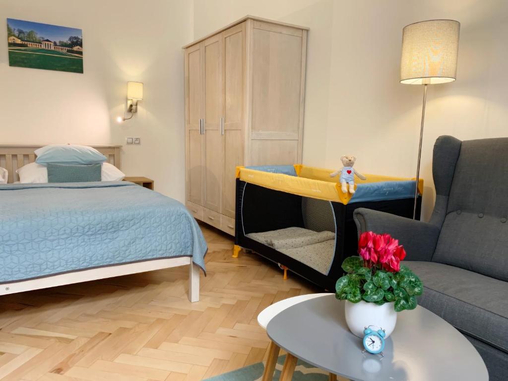 Łóżko lub łóżka w pokoju w obiekcie Marienbad Apartment