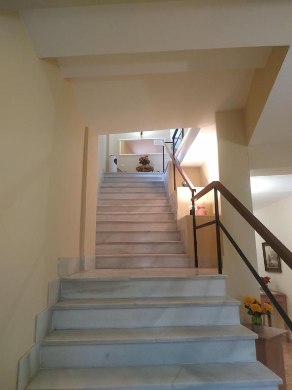a staircase in a house with blue stairs at Hostal El Rincón - Casa Marcos in Yepes