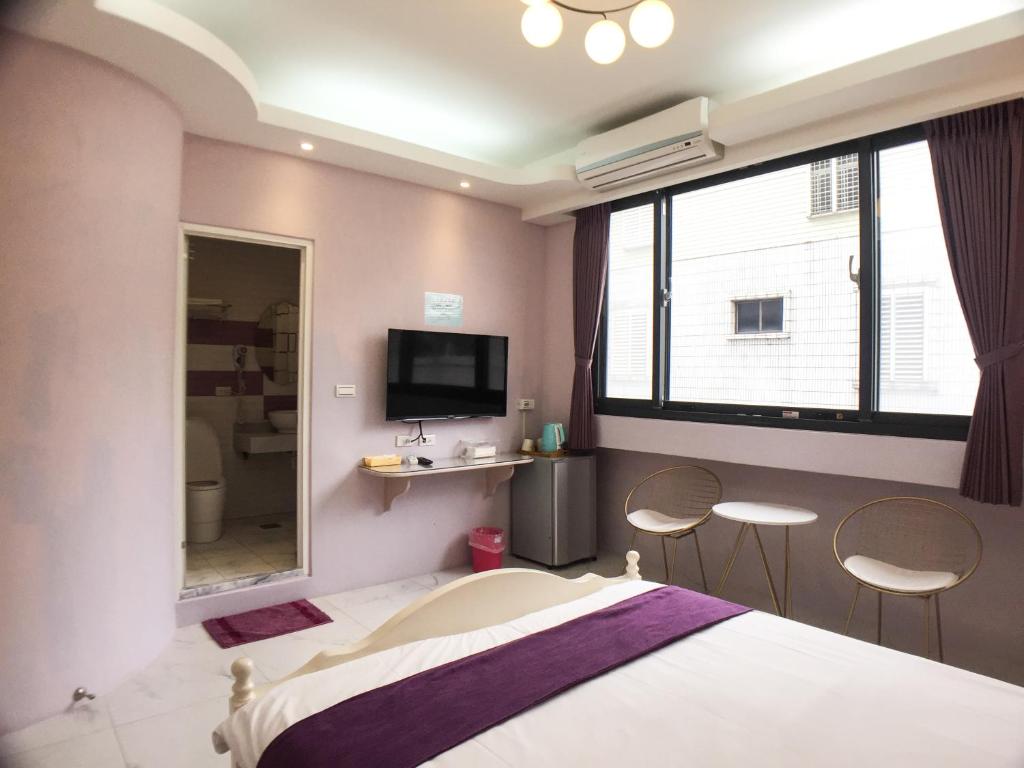 Postel nebo postele na pokoji v ubytování Hualien Dawan B&B