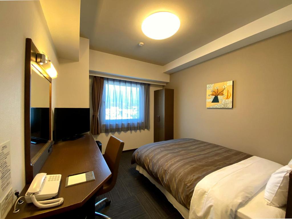 TV a/nebo společenská místnost v ubytování Hotel Route-Inn Ina Inter