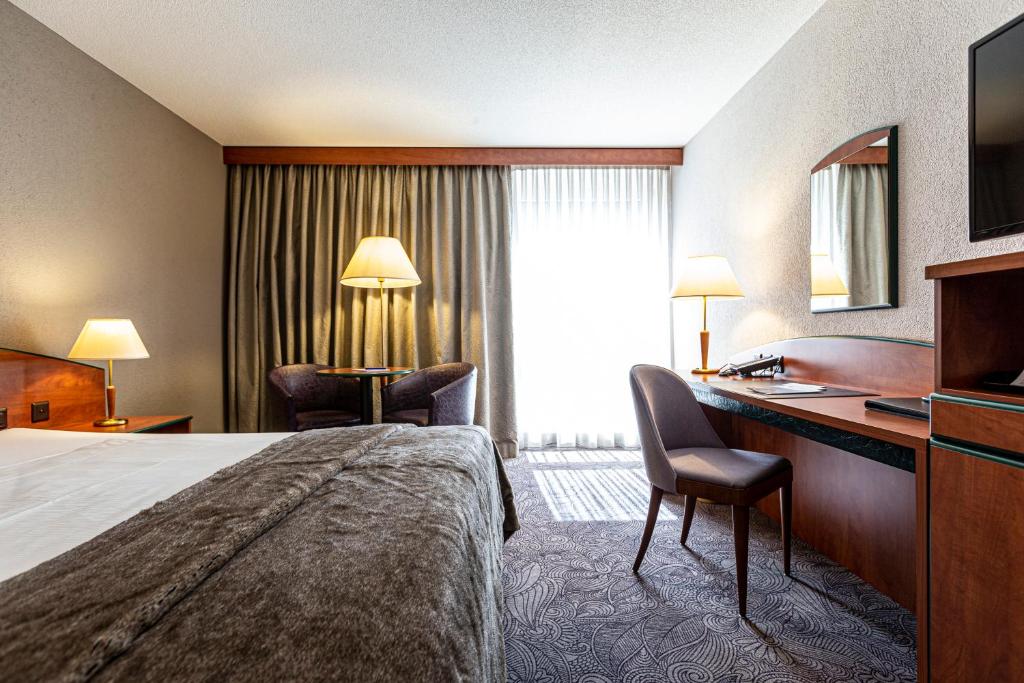 Postel nebo postele na pokoji v ubytování Hotel Münchwilen