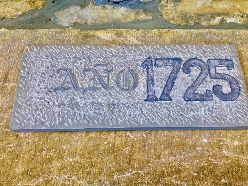 a sign that says new on the ground at Gran Pedroso de Llanes in Llanes