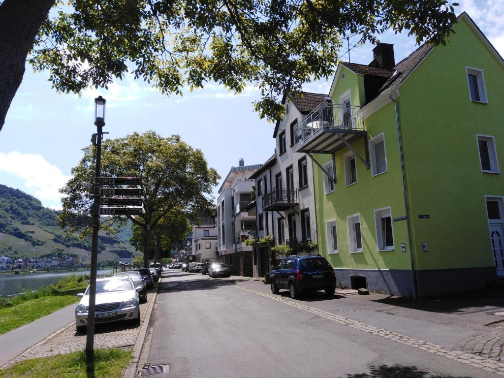 a street with houses and cars parked on the side of the road at Haus Margarete in Zell an der Mosel
