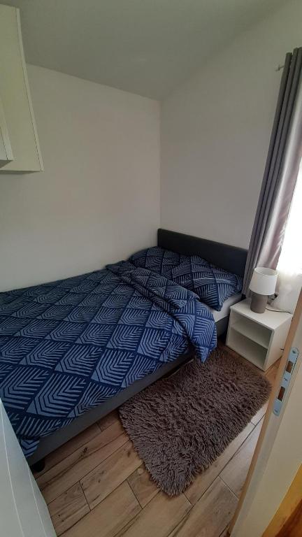 Postel nebo postele na pokoji v ubytování Tiny House Grabovac