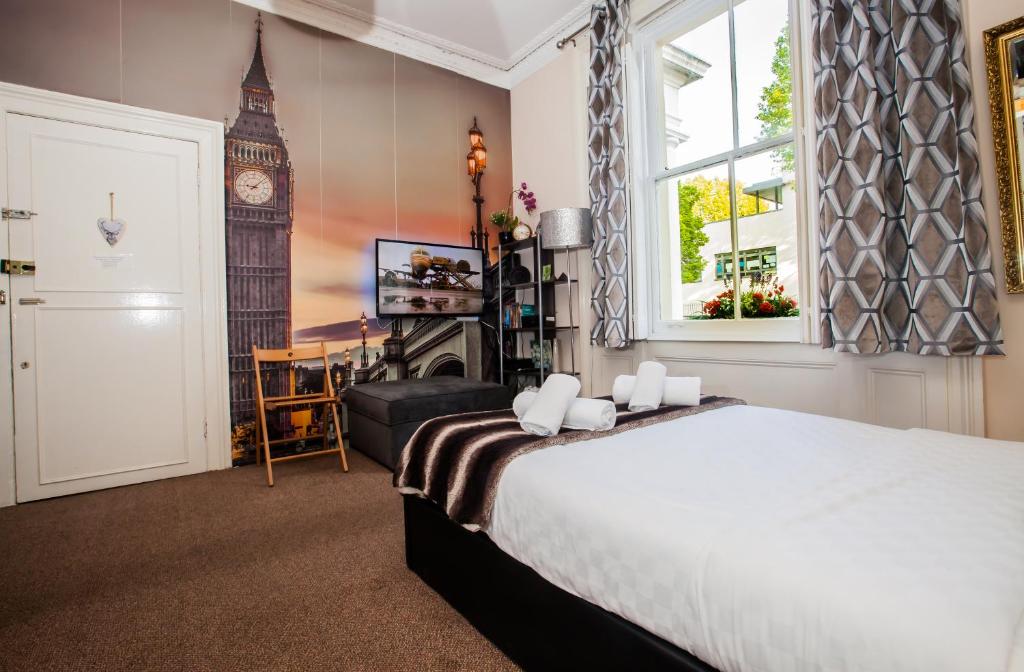 a bedroom with a large bed and big ben at Pimlico Central London Suite near Victoria in London