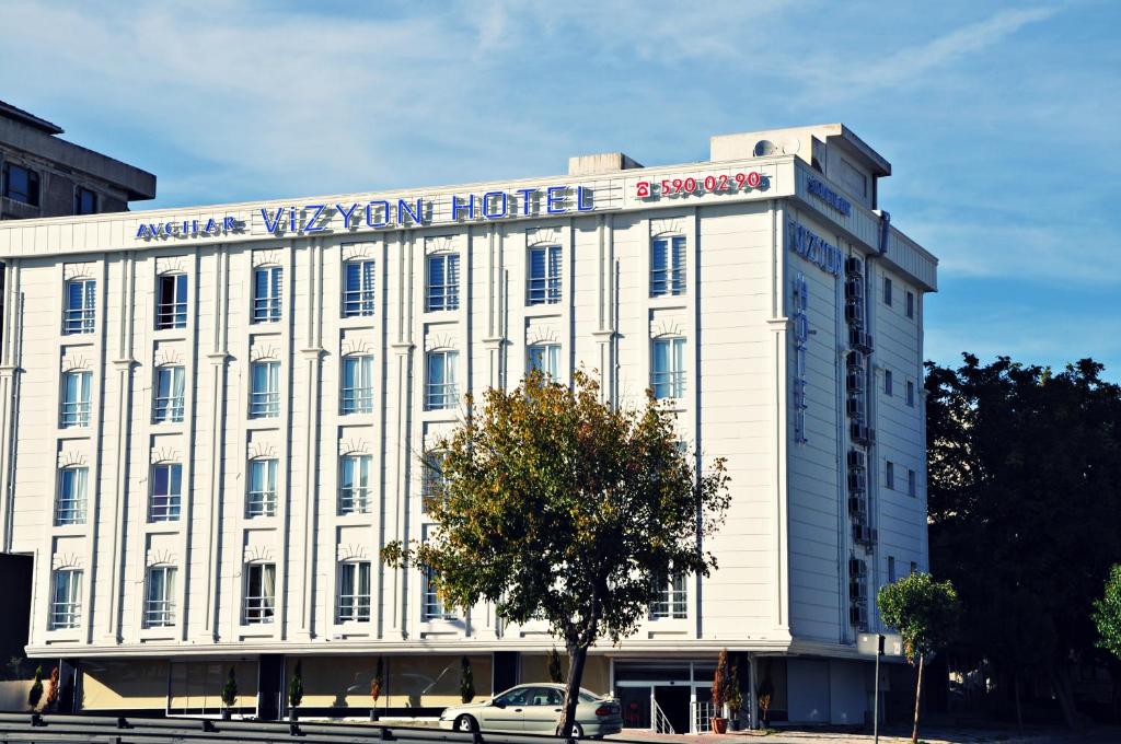 a large building with a large clock on the front of it at Avcilar Vizyon Hotel in Istanbul