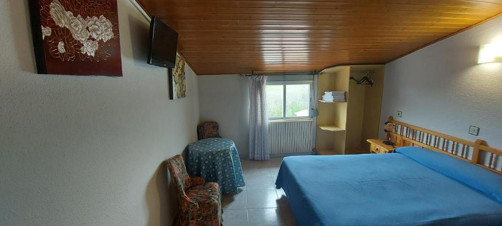 Postel nebo postele na pokoji v ubytování Hostal del campo