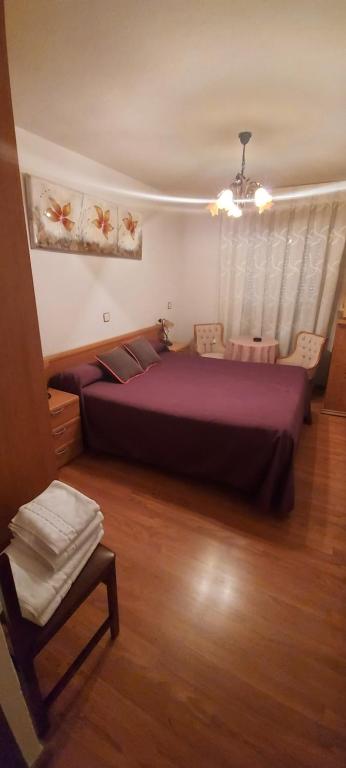 Postel nebo postele na pokoji v ubytování Hostal del campo