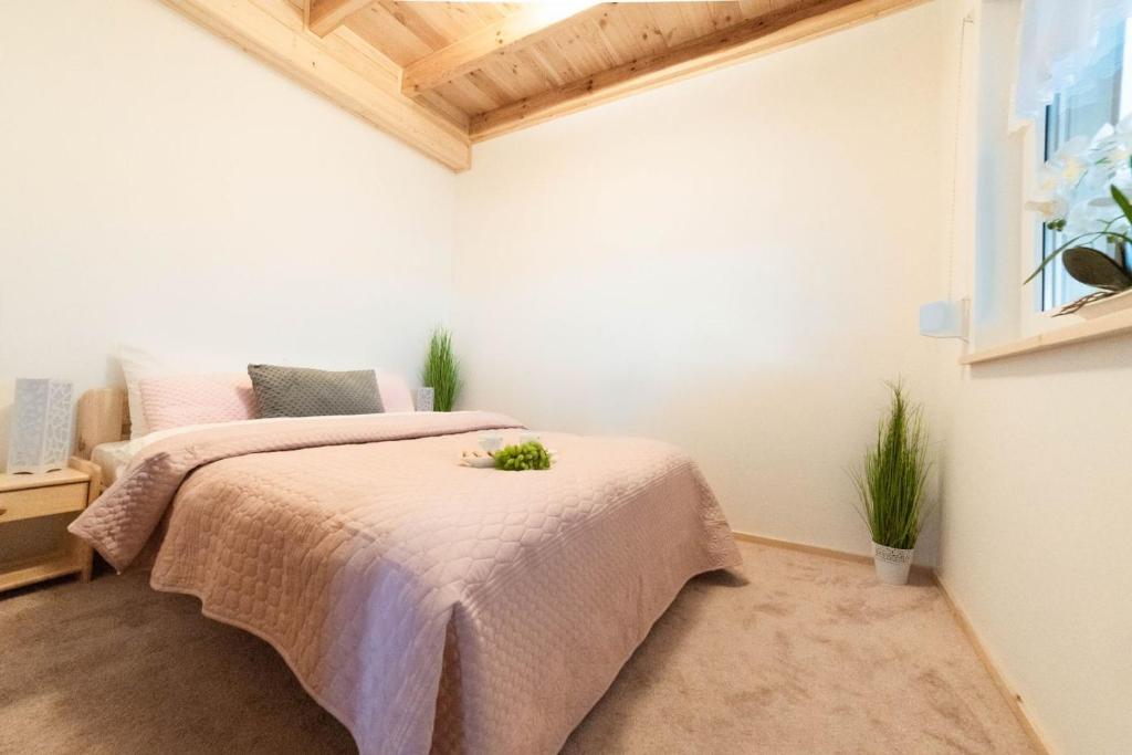 Posteľ alebo postele v izbe v ubytovaní Apartamenty Liberta