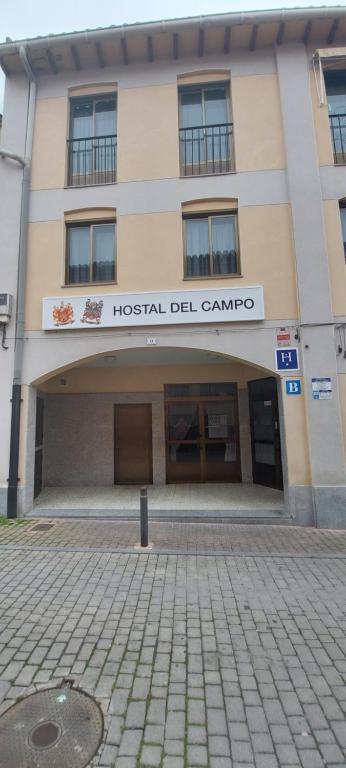 a building with a hospital del campo sign on it at Hostal del campo in Arévalo