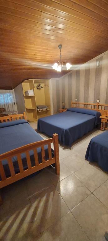 Postel nebo postele na pokoji v ubytování Hostal del campo