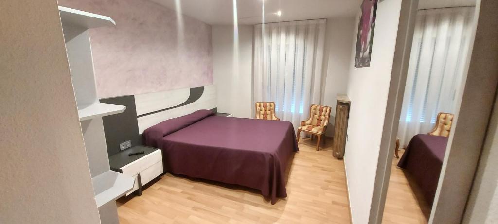 Postel nebo postele na pokoji v ubytování Hostal del campo