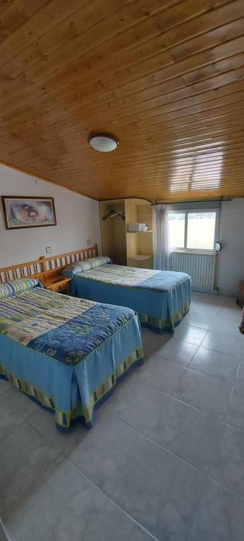 Postel nebo postele na pokoji v ubytování Hostal del campo