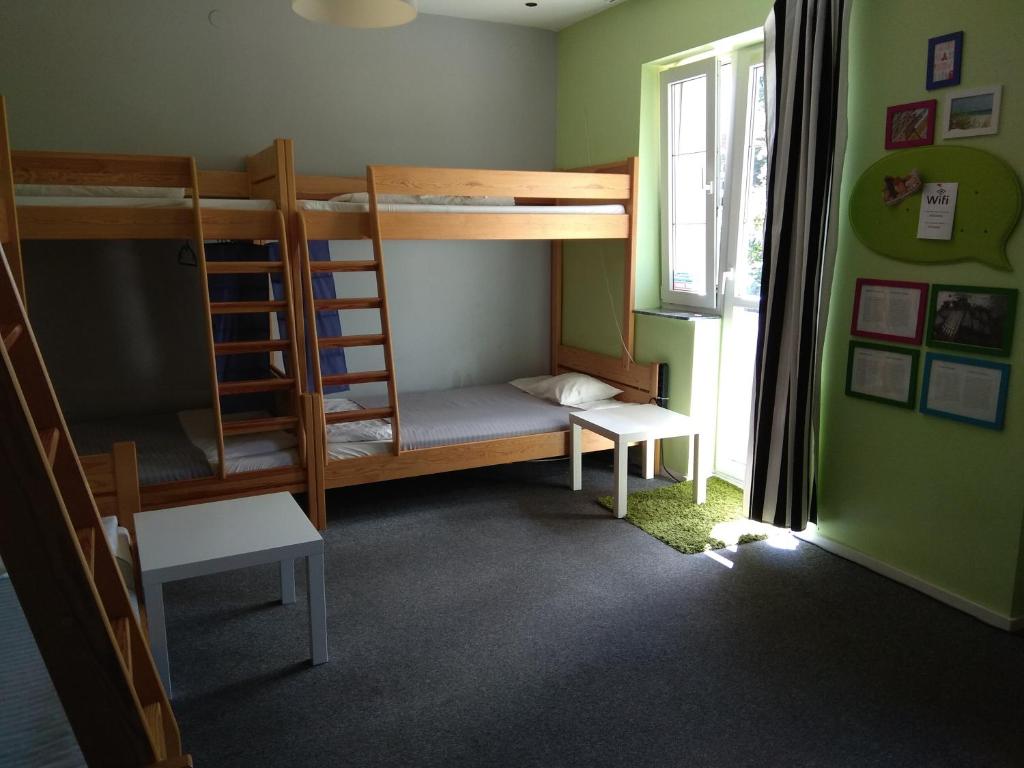 Postel nebo postele na pokoji v ubytování Olive Hostel