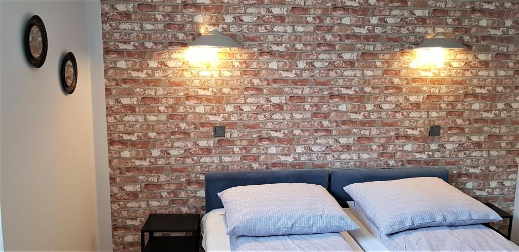 Posteľ alebo postele v izbe v ubytovaní APARTAMENT CENTRUM PARK ul WASZYNGTONA