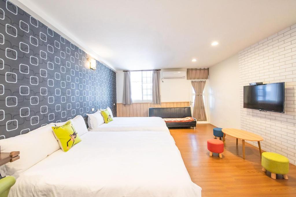 Postel nebo postele na pokoji v ubytování Luodong Nightmarket Homestay