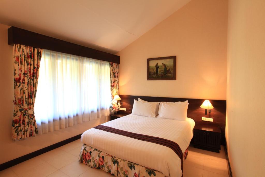 Postel nebo postele na pokoji v ubytování Belle Villa Resort, Chiang Mai