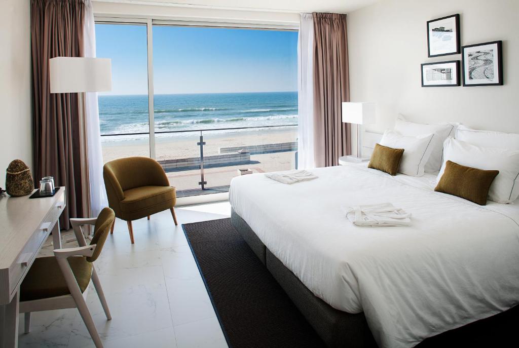 Giường trong phòng chung tại Furadouro Boutique Hotel Beach & SPA