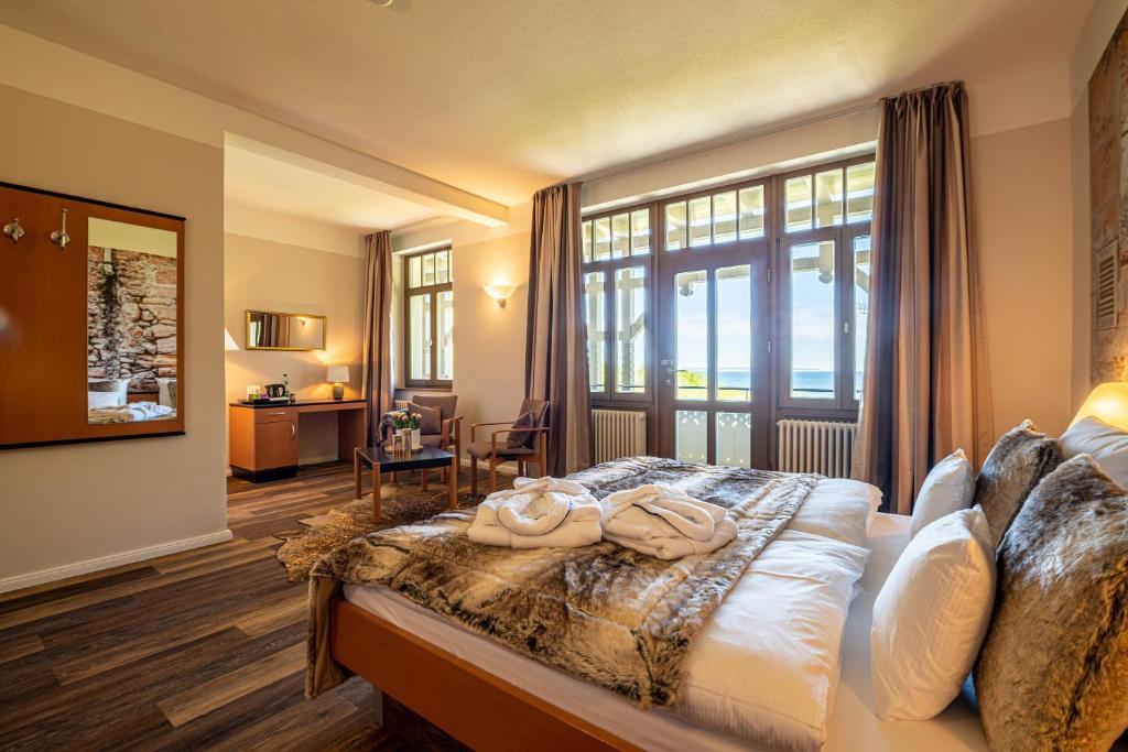 Postel nebo postele na pokoji v ubytování Hotel Villa Halliger