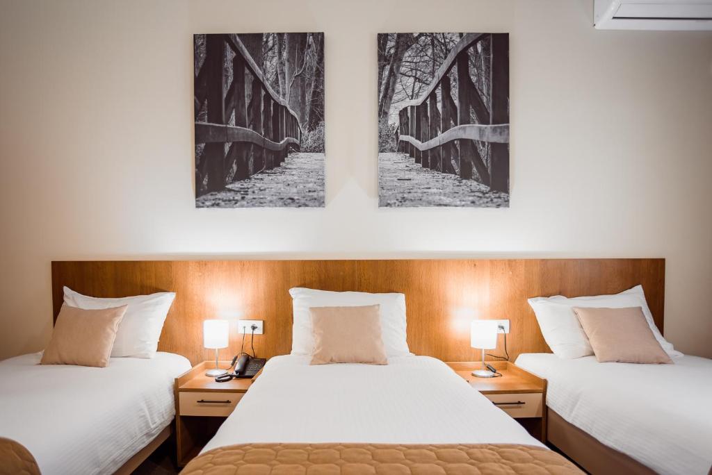 Giường trong phòng chung tại Sajam Garni hotel