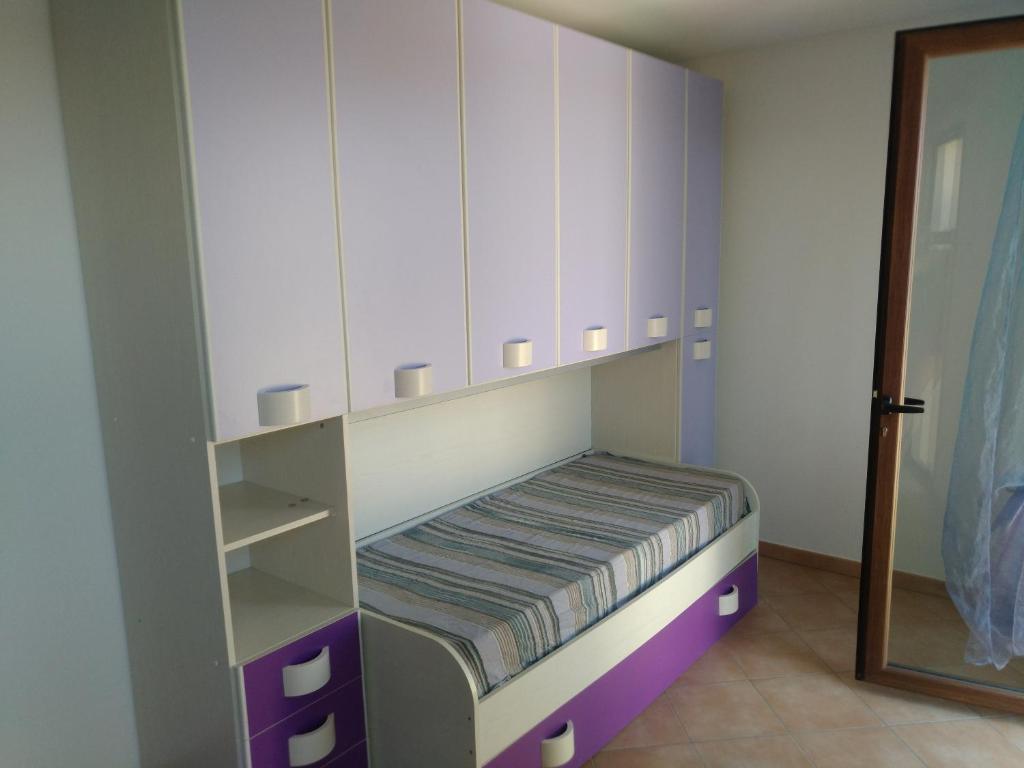 Postel nebo postele na pokoji v ubytování Orchidea