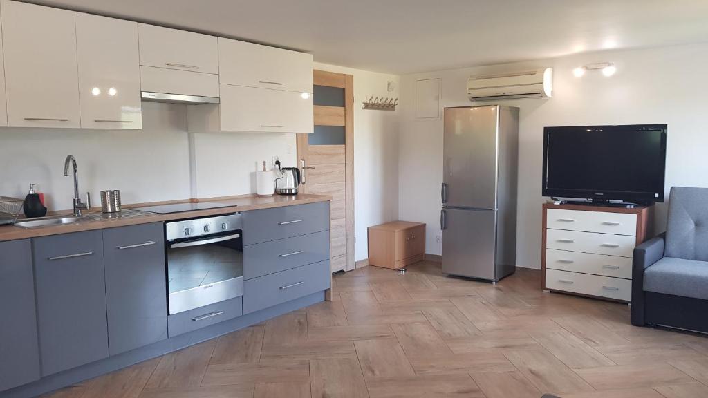 Kuchyňa alebo kuchynka v ubytovaní Apartamenty Mazury