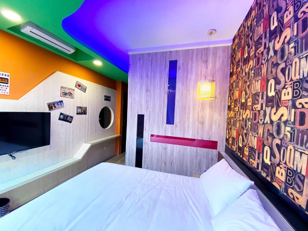 Postel nebo postele na pokoji v ubytování 奧斯卡海景民宿Oscar Boutique Seaview Homestay