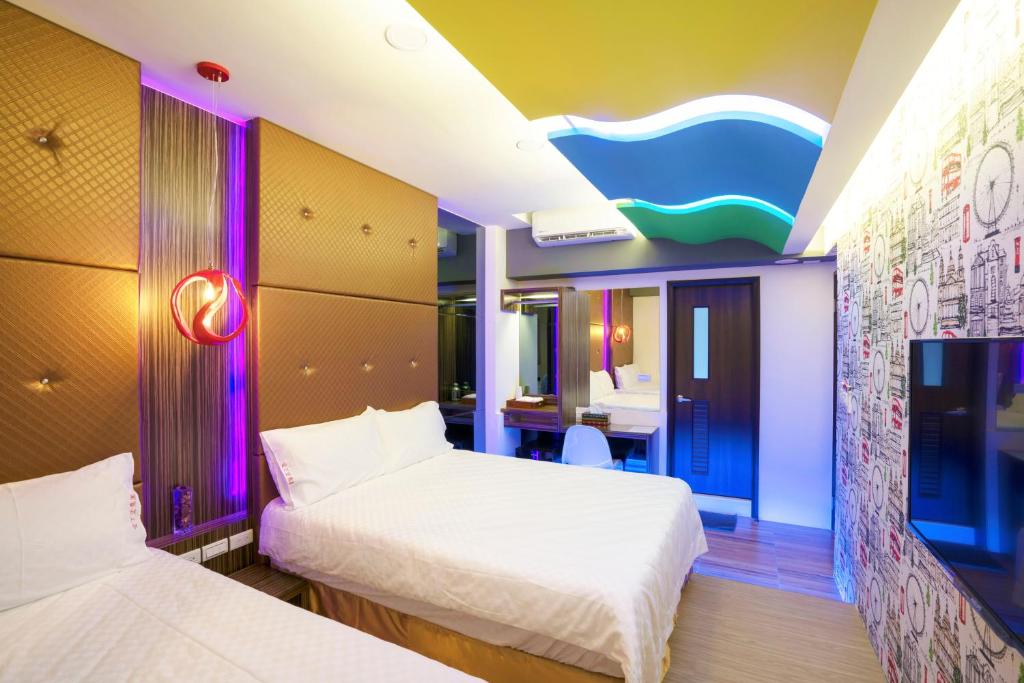 Postel nebo postele na pokoji v ubytování 愛丁堡集團市區精品及國王雙館民宿Edinburgh Boutique Hotel