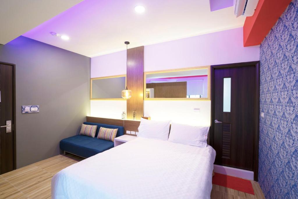 Postel nebo postele na pokoji v ubytování 愛丁堡集團市區精品及國王雙館民宿Edinburgh Boutique Hotel