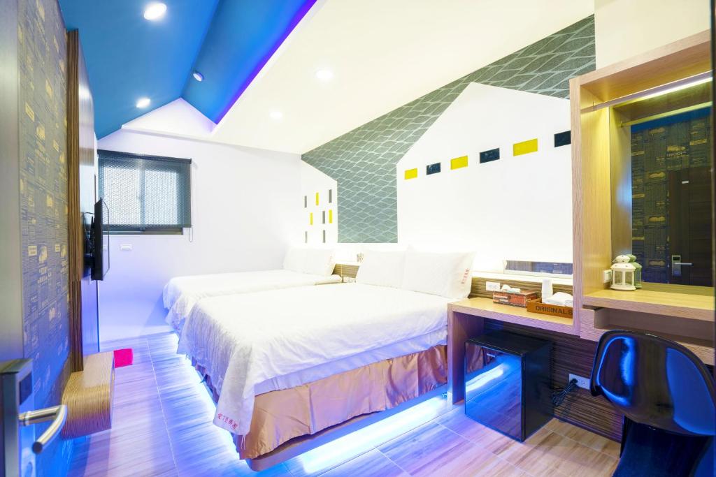 Postel nebo postele na pokoji v ubytování 愛丁堡集團市區精品及國王雙館民宿Edinburgh Boutique Hotel