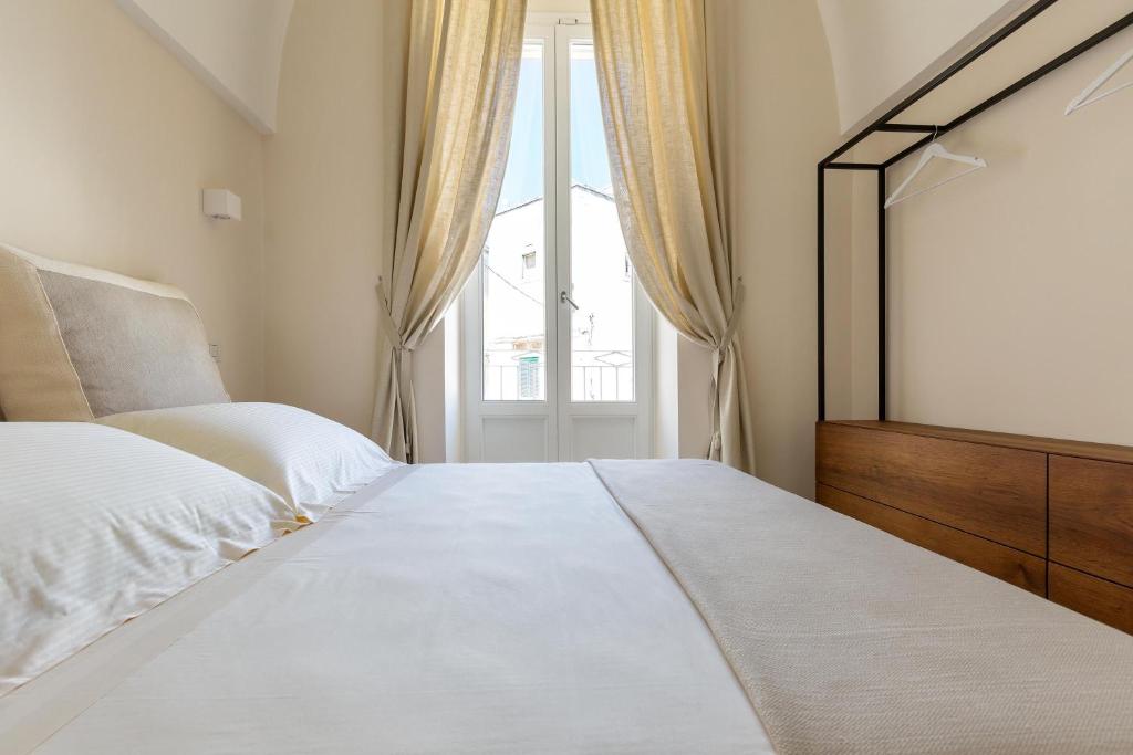 Postel nebo postele na pokoji v ubytování Palazzo Mascetti