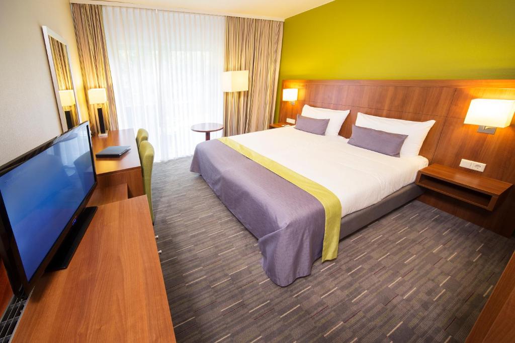 TV a/nebo společenská místnost v ubytování Fletcher Hotel-Restaurant De Buunderkamp
