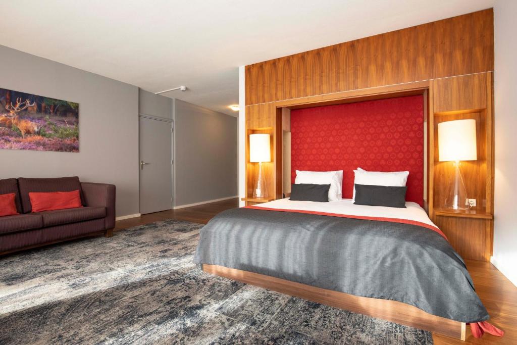 Postel nebo postele na pokoji v ubytování Fletcher Hotel-Restaurant De Buunderkamp
