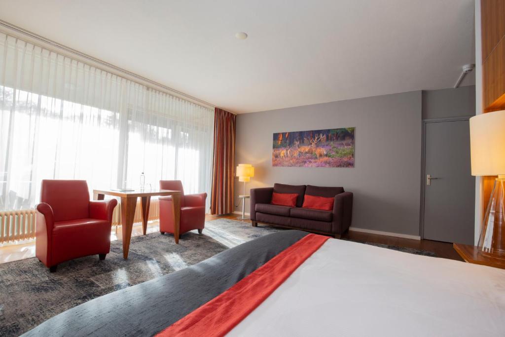 Postel nebo postele na pokoji v ubytování Fletcher Hotel-Restaurant De Buunderkamp