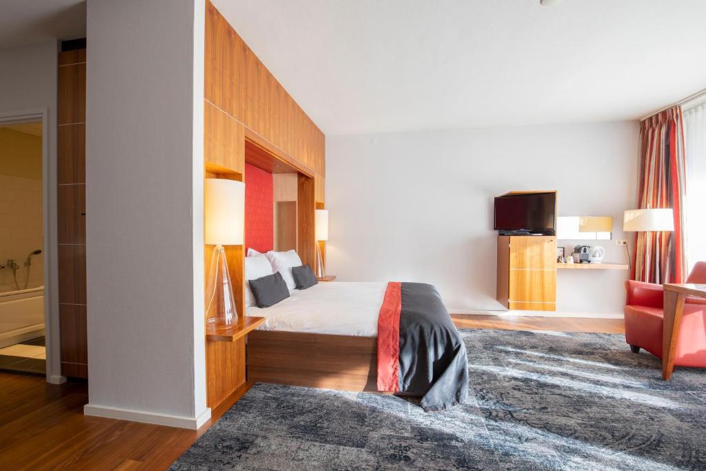 Postel nebo postele na pokoji v ubytování Fletcher Hotel-Restaurant De Buunderkamp