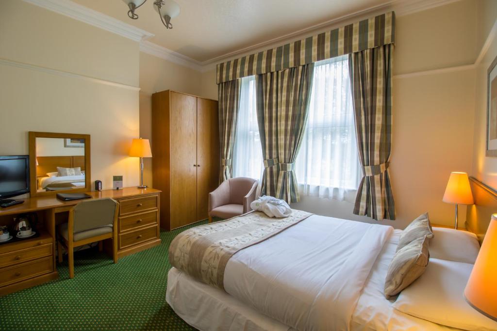 Postel nebo postele na pokoji v ubytování A Park View Hotel