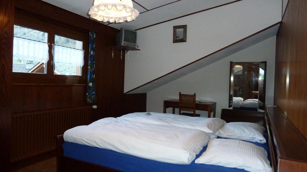 Postel nebo postele na pokoji v ubytování La Vallée Hôtel &Spa
