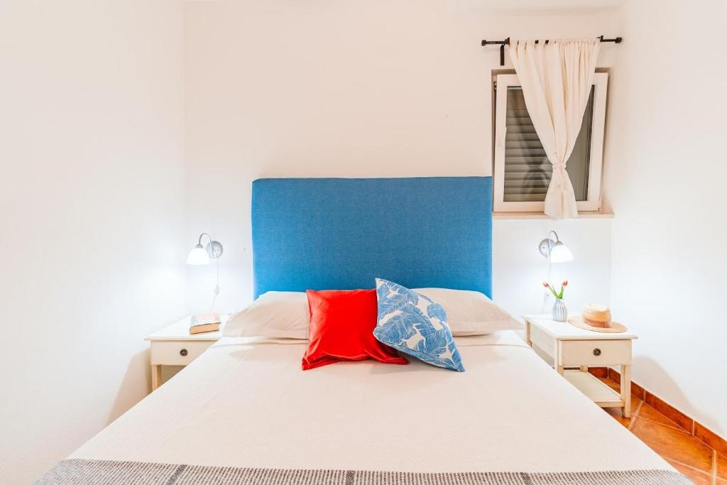 Postel nebo postele na pokoji v ubytování Sutivan Best Apartments