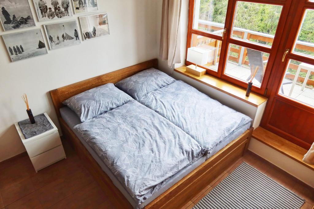 Postel nebo postele na pokoji v ubytování Cihlářka - horský apartmán 103