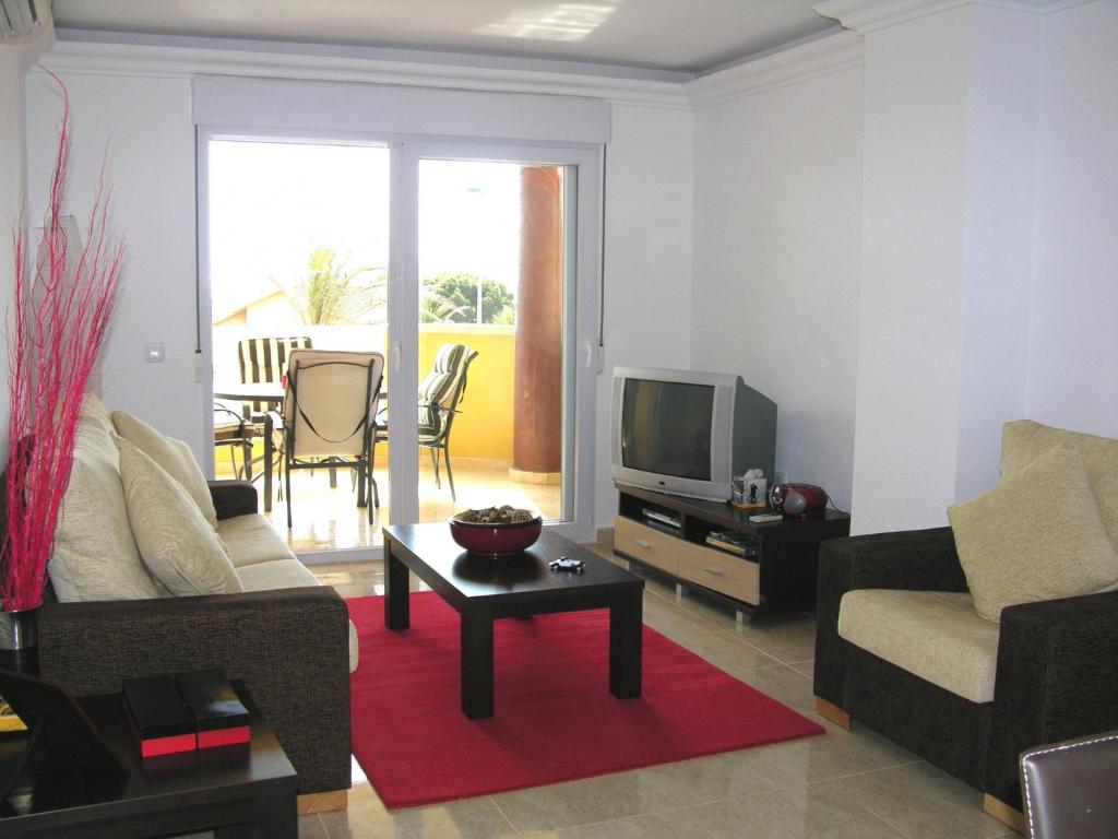 A television and/or entertainment centre at Playa Principe - 6507
