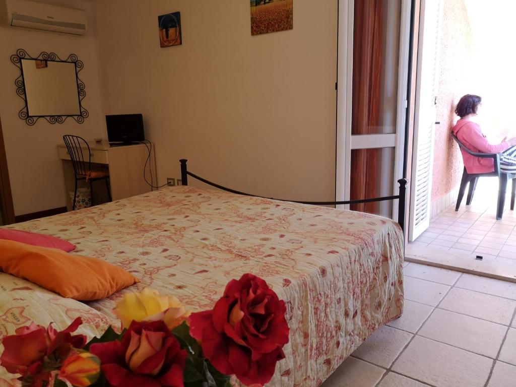 Postel nebo postele na pokoji v ubytování A Due Passi Dal Mare B&B