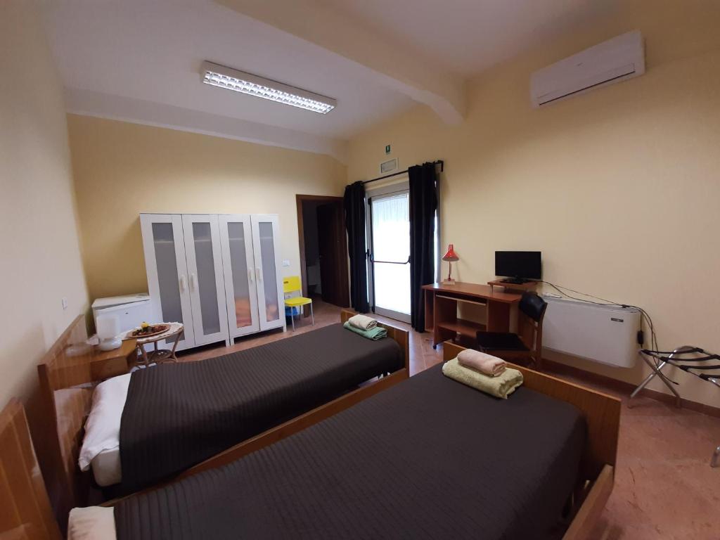 Postel nebo postele na pokoji v ubytování La Cascina del Sole
