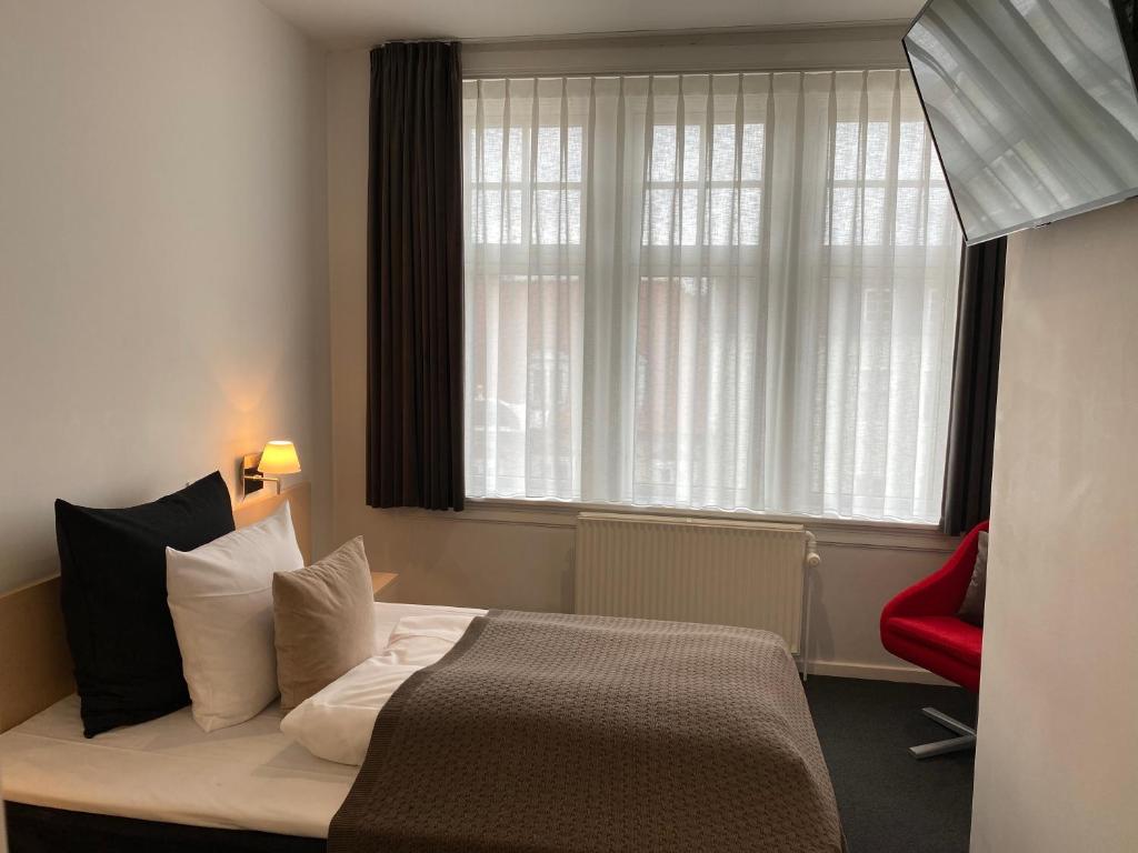 Postel nebo postele na pokoji v ubytování Teaterhotellet