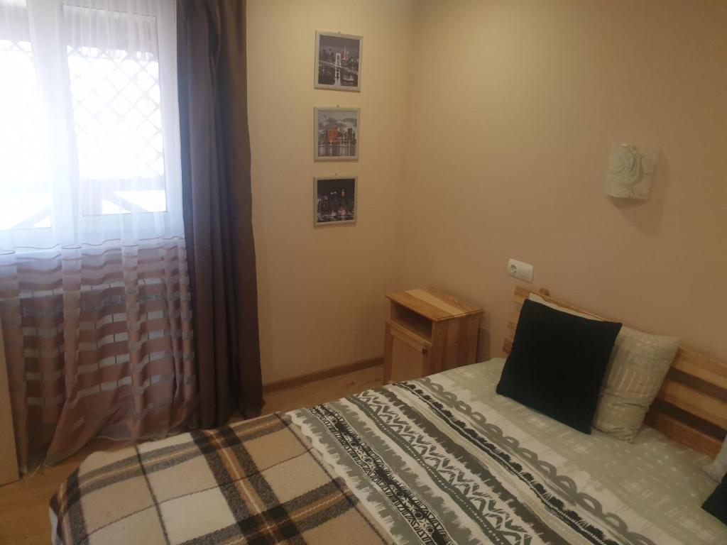 Postel nebo postele na pokoji v ubytování Садиба "У Юлії"